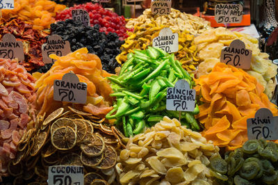 Various dry fruits displayed at market stall