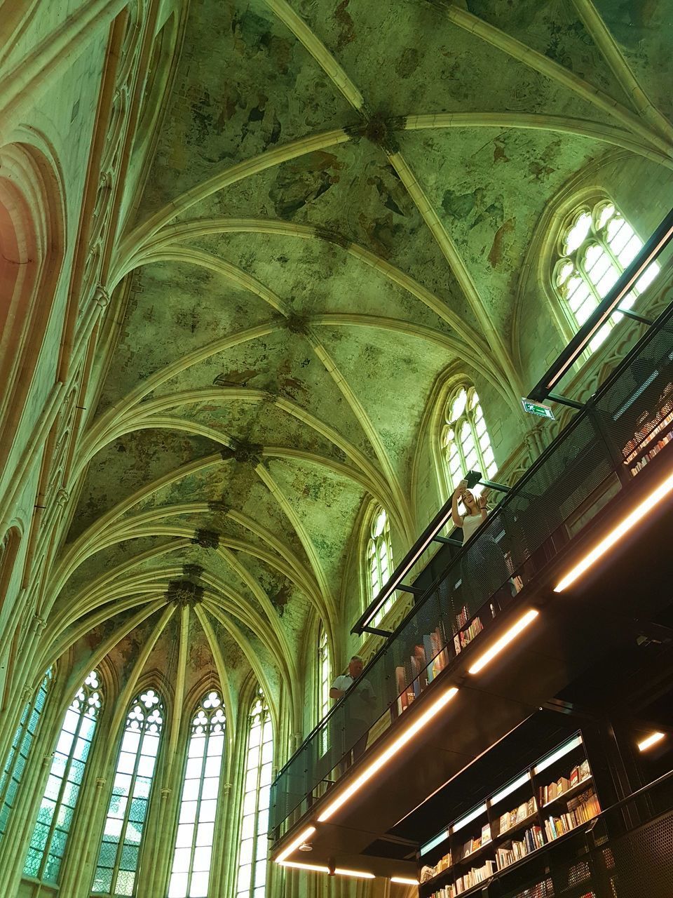 LOW ANGLE VIEW OF ILLUMINATED CEILING AT BUILDING