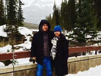 Portrait of couple standing during winter