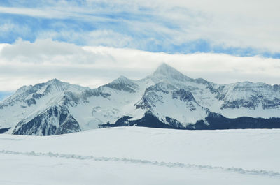 Scenic view of snowcapped mountains against sky