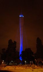 Illuminated building against sky at night
