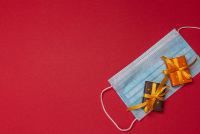 High angle view of christmas decoration on red background