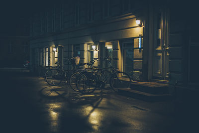 Bicycle in illuminated room at night