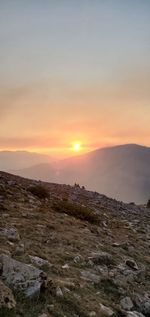 Scenic view of landscape against sky during sunset