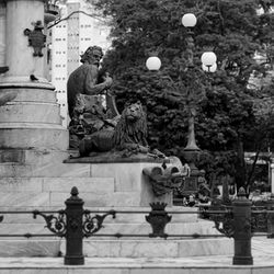 Statue of people on street