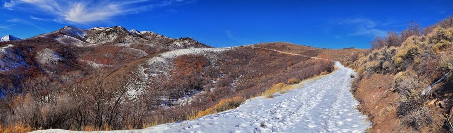 Scenic view of snowcapped mountains against sky