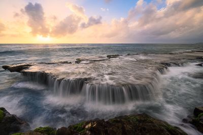 Scenic view of sea against sky during sunset