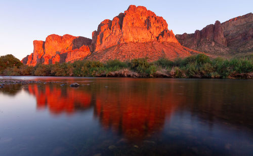 Scenic view of lake and mountains against sky