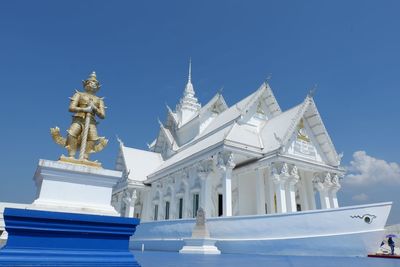 Low angle view of building against blue sky