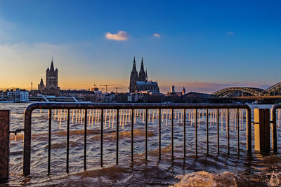 Bridge over river with city in background