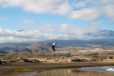 Airplane flying over landscape at canary islands