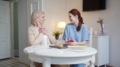 Female doctor working at home