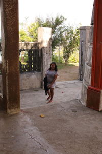 Man playing in front of building