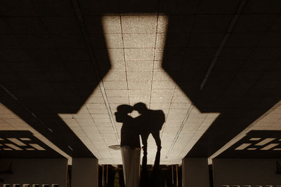 Low section of man walking on street