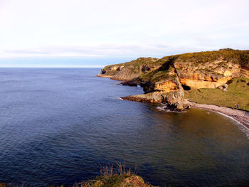 Scenic view of sea against cloudy sky