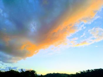 Low angle view of dramatic sky during sunset