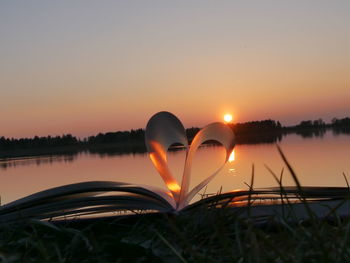 Heart shape against sky during sunset