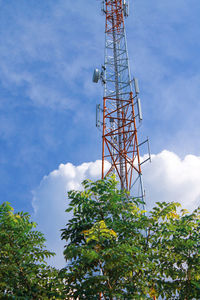 Low angle view of communications tower against sky