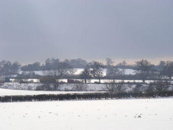 Scenic view of winter against sky