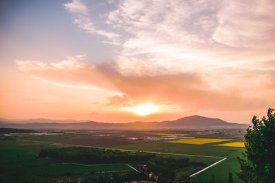 Scenic view of landscape against sky during sunset