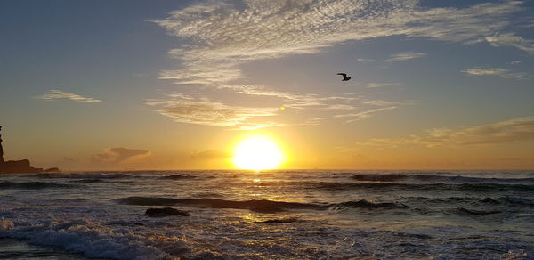 Scenic view of sea against sky during sunset