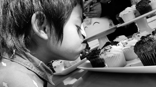 Close-up of girl eating food
