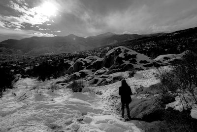 Tourists on snow covered mountain