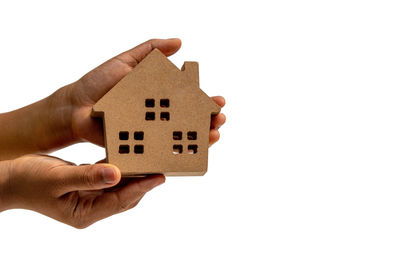 Hand holding toy over white background