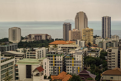 High angle view of buildings in city against sky