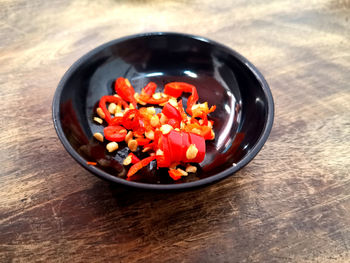 High angle view of chopped vegetables in bowl on table