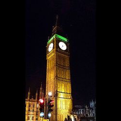 Low angle view of tower at night