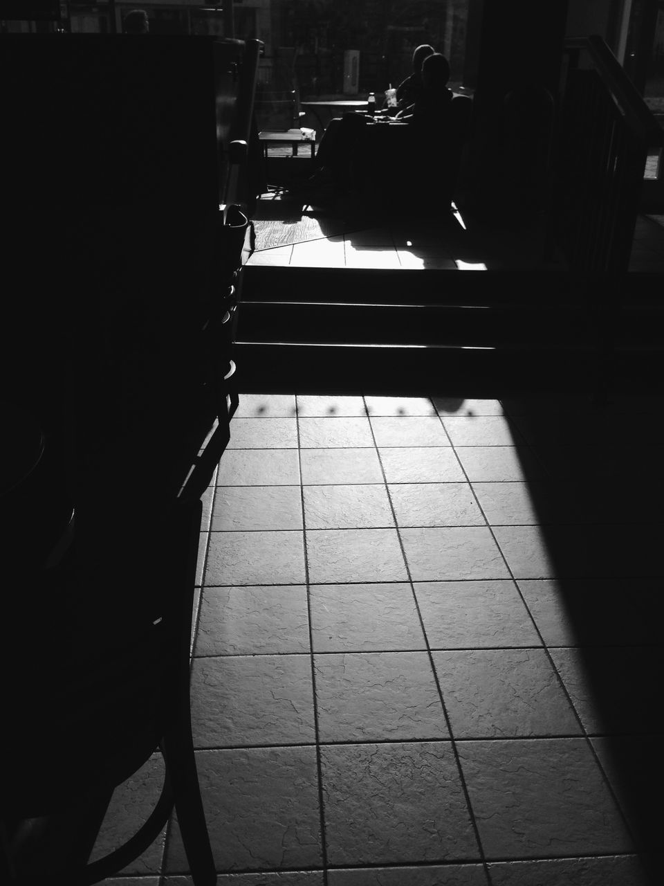 indoors, tiled floor, chair, flooring, sitting, sunlight, shadow, full length, high angle view, men, empty, day, rear view, seat, built structure, incidental people, architecture, person