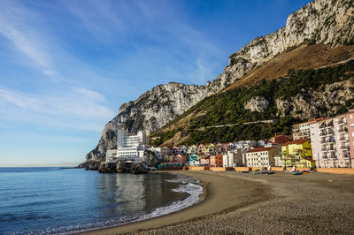 View to catalan bay beach with caleta hotel and colorful residential houses