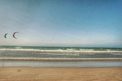 Scenic view of beach against sky