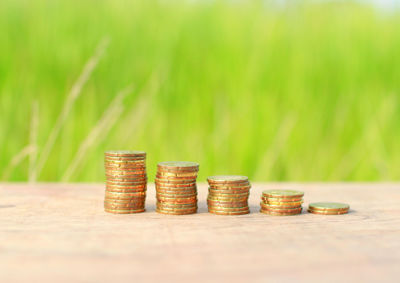 Stack of coins on wooden table