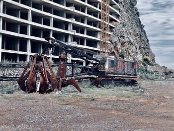 Old rusty metallic structure on land