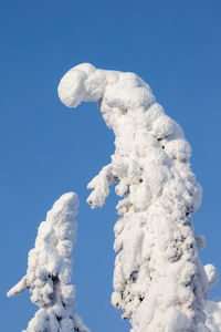 Low angle view of vapor trail against clear blue sky