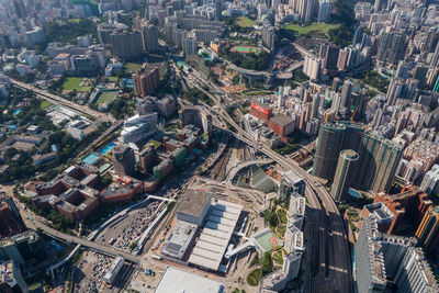 High angle view of crowd on road amidst buildings in city