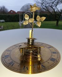 Close-up of clock on table