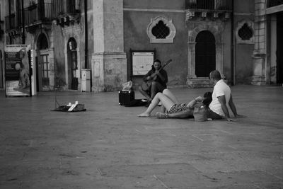 Man sitting in town square