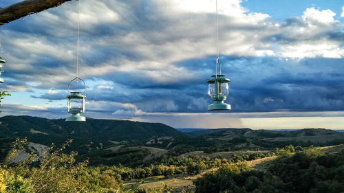 Scenic view of mountains against cloudy sky