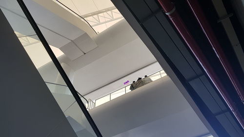 Low angle view of man on ceiling