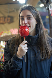 Portrait of woman holding ice cream