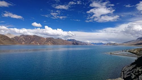Scenic view of sea against blue sky