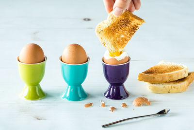 Eggs in egg cups with toast.