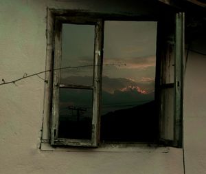 Close-up of window against sky