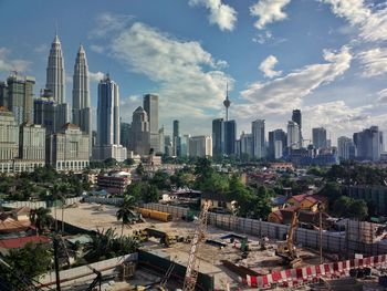 Modern buildings in city against sky