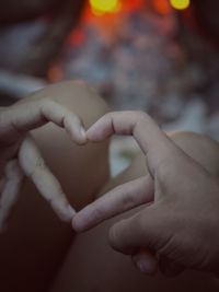 Two hands making a heart symbol