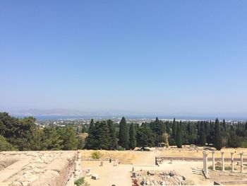 Scenic view of field against clear blue sky