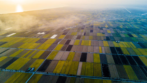 Aerial view of agricultural field against sky